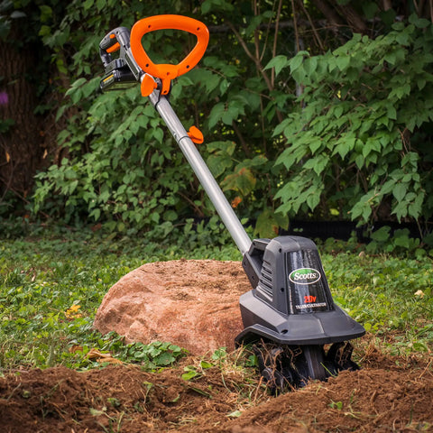20V Cordless Garden Tiller Cultivator with 7.5 Inch Width, 6 Inch Depth, 4 Steel Tines in a garden setting