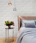 Top Shelf Vinyl Textured Wallpaper In Crisp Off White Cream Accented With Shimmery Gold Mica Chips Washable Removable And Humidity Friendly Wall Roll For Low Key Room Refreshes in a modern bedroom setting.