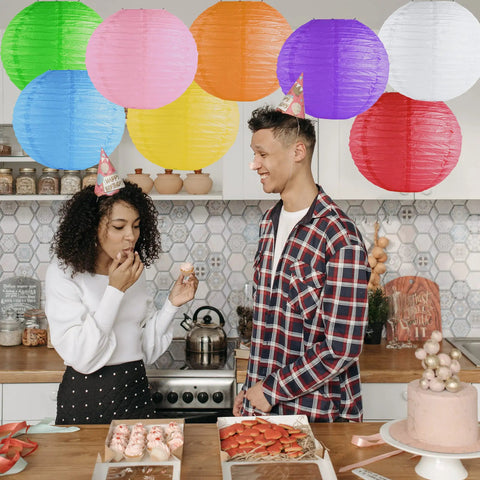 8 Inch Colorful Assorted Chinese And Japanese Hanging Paper Lanterns With Metal Frame For Home Lamps Party And Event Decoration 8 Pack Party Ready Indoor Outdoor Celebrations displayed above a kitchen party scene.