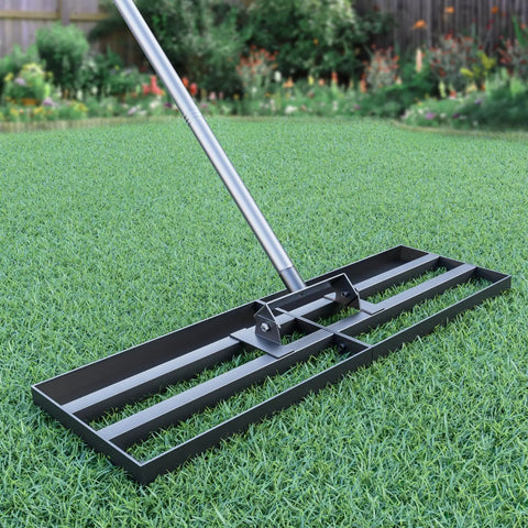 Beast Heavy Duty Lawn Leveling Rake With 30 Inch By 10 Inch Head And 78 Inch Adjustable Stainless Steel Handle on green grass