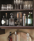 Kitchen cabinet with Esquire Satin Nickel And Oil Rubbed Bronze Cabinet Pull 128 mm Center To Center Drawer Handle, barware displayed inside.