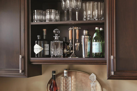 Kitchen cabinet with Esquire Satin Nickel And Oil Rubbed Bronze Cabinet Pull 128 mm Center To Center Drawer Handle, barware displayed inside.
