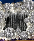 Metallic Silver Disco Balloons In Mixed Sizes 32-Inch, 22-Inch, And 10-Inch - 20 Count 4D Mylar Balloons For 70s 80s Disco Theme Parties, Birthday Or New Year Decor, Shiny Reflective Party Supplies arranged against tinsel backdrop.