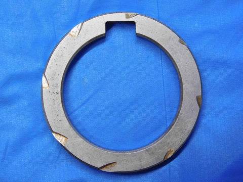 Top Shelf Bulk Lot Of Eight Precision Milling Machine Arbor Spacers For Your Shop Rig One Inch To One Nine Sixteenths Inside Diameter tool, heavy-duty steel spacer viewing top-down on blue background.