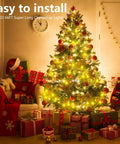 Warm White 200 LED Christmas Lights 66ft Outdoor Indoor String Light with Remote Control 8 Modes Memory Timer Plug In Green Wire for Tree Yard Party Xmas Decor. Image of a decorated Christmas tree with glowing warm white LED lights, surrounded by wrapped gifts indoors.