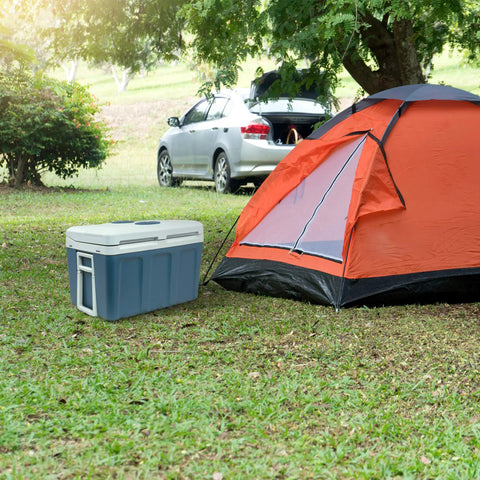 Top Notch 48 Quart Electric Cooler And Warmer With Wheels Grab And Go Thermoelectric Portable Fridge beside a camping tent.