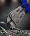 Close-up of 14 Inch Heavy Duty Bolt Cutter Built Tough With Ergonomic Anti Slip Handles For Cutting Locks Chains Wires And Chain Link Fences Made From T8A Steel For High Hardness And Long Lasting Performance cutting a metal chain