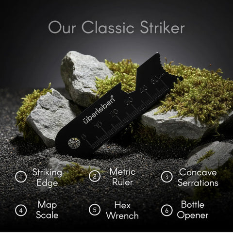 Multi tool striker on rocks featuring metric ruler, concave serrations, used with Ferro Rod Fire Starter Survival Tool With Hardwood Handle.