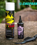 Drivetrain Cleaning And Lubrication Essentials Kit With Bicycle Degreaser And Lubricant Brush Tool displayed on outdoor surface