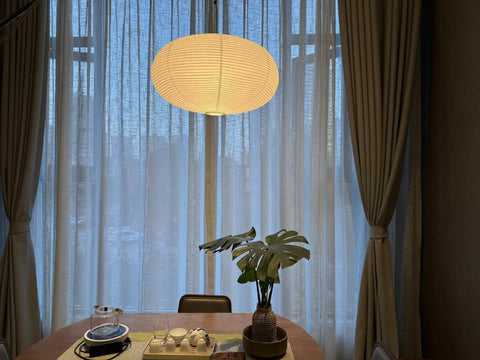 Large White Chinese Paper Ceiling Lamp Shade And Oval Pendant Light Cover With Vintage Round Chandelier Lantern Design, cozy dining area.