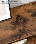 Top view of Game Changer Three Tier Industrial Console Table With Real Deal Storage Shelves showing rustic brown wood surface.