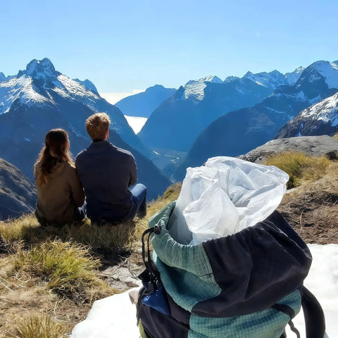 Backpack with Heavy Duty Nylon Pack Liner Bags 20 By 36 Inch 10 Pack, clear, in mountain setting, perfect for camping.