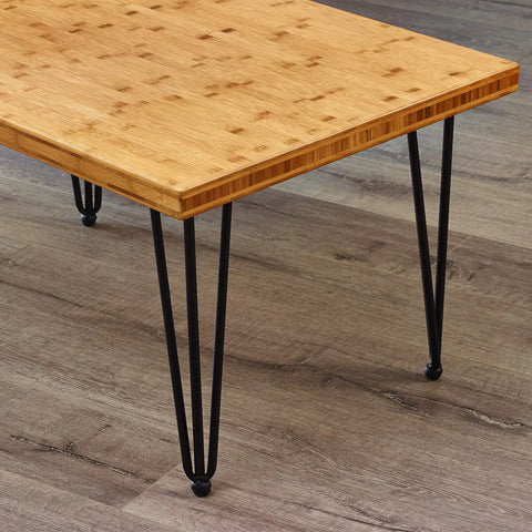 Hairpin Metal Table Legs 20 Inch Set of 4 With Black Screws And Adjustable Cushion Floor Protectors For DIY Furniture Coffee Table Bench Dining End Table Industrial Mid Century Modern Style supporting a wooden table top.
