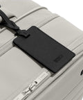Softside Bigger Carry On Luggage 23 Inch Expandable With Spinner Wheels Built Tough Nylon TSA Accepted Color Matching Padlock Airline Approved For Most Major Airlines Cloud Gray with tag detail