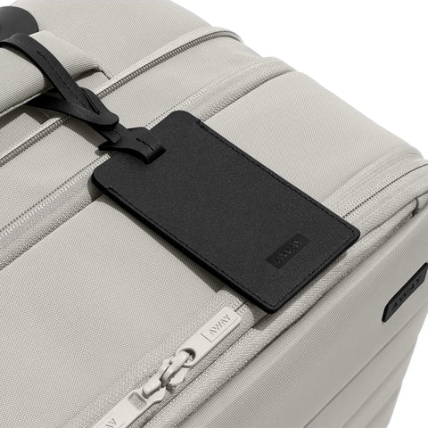 Softside Bigger Carry On Luggage 23 Inch Expandable With Spinner Wheels Built Tough Nylon TSA Accepted Color Matching Padlock Airline Approved For Most Major Airlines Cloud Gray with tag detail