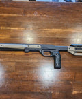 Oryx Sportsman Tika T1X SA Right Hand Chassis System Black Rifle Stock on wooden table