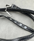 Close-up of leather strap with metal rivets for Workhorse Chicago Screw Rivet Kit For Leather Bags And Photo Albums 304 Stainless Steel