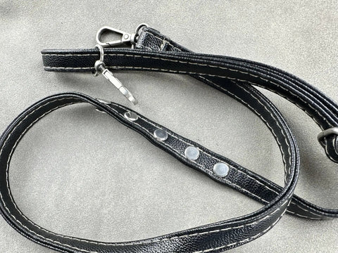 Close-up of leather strap with metal rivets for Workhorse Chicago Screw Rivet Kit For Leather Bags And Photo Albums 304 Stainless Steel