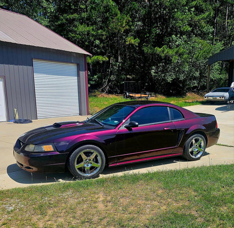 Dead Straight Automotive Colorshift Basecoat Midcoat One Gallon Ready To Roll With Slow Reducer Mix on a purple-black sports car exterior.