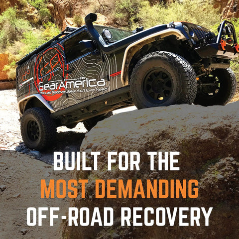 Off-road vehicle on rocky terrain with Gear America branding, showcasing Heavy Duty Snatch Block Pulley 25T Capacity for recovery.