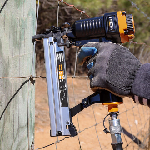 Using a pneumatic 18 gauge fencing stapler with belt hook, seven eighths inch staples, collated for mesh and trellis fencing on a post