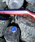 Two Forty Classic.177 caliber air rifle with hardwood stock on logs, fiber optic sights visible