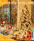 Christmas Curtain Lights 300 LED 9.8 By 9.8 Feet Waterproof Outdoor Curtain String Lights with remote beside Christmas tree