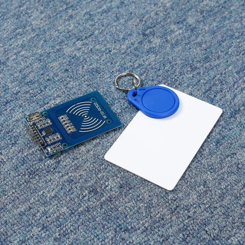 Mifare RC522 NFC Reader Module Kit With S50 White Card And Key Ring displayed on blue surface