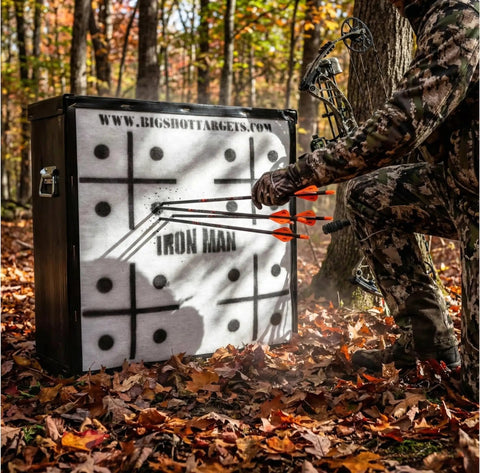 Archer using Iron Man 30 Inch Archery Target For Personal Range, 475 FPS Rated, Beastly Durable High Density Shell in forest setting
