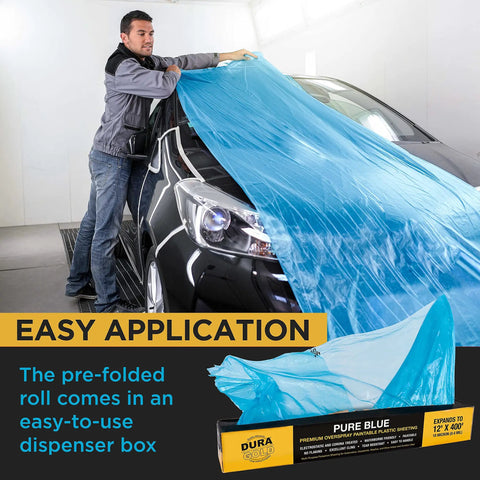 Man covering car with Blue Protective Masking Film Cover For Painting Projects Overspray Shield Paintable Plastic Sheeting Roll 20 Feet By 250 Feet 10 Micron Thin Electrostatic Cling Auto And Home Painting Protection For DIYers.
