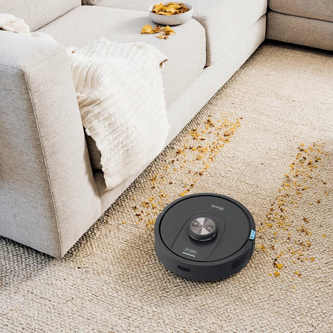 Robot Vacuum With Matrix Clean And Precision Mapping Self Empty Base With 30 Day Capacity Bagless Powerful Pet Hair Cleaning WiFi Enabled Black Renewed on carpet near sofa