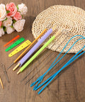 15Pcs Quick Turn Fabric Set For No Fuss Tube Turning Easy Peasy DIY Sewing Quilting And Patchwork Multifunctional Tube Turner Tool Kit For Threading Garment Making Home Decor Projects displayed on a wooden table with colorful tools and accessories.