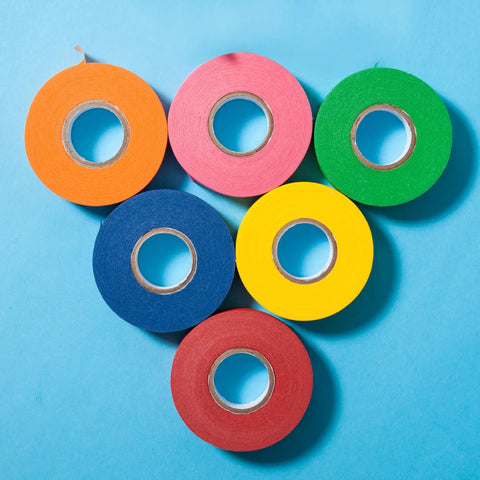 Colored Masking Tape Set 0.6 Inch By 15 Yards 6 Pack In Vibrant Yellow Green Blue Orange Pink Red displayed on blue background