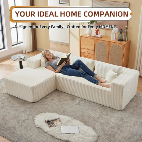 Person relaxing on No Fuss 107 Inch Modular Sofa Set Of 2 With Left Facing Chaise, White Corduroy Fabric in living room