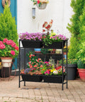 32 Inch Tall Elevated Raised Garden Bed With Trellis And Sturdy Legs For Vertical Outdoor Gardening Of Vegetables Herbs And Flowers In Four Separate Planter Boxes For Balcony Patio Or Backyard Black with colorful flowers on a patio.