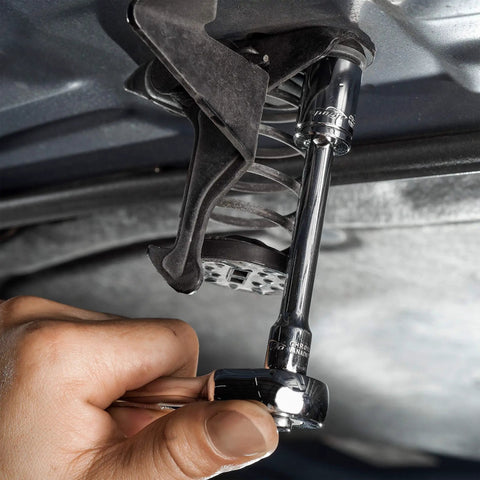 Close-up of Pro Grade 122 Piece Mechanics Tool Set With Sockets And Ratchets In SAE And Metric For Auto And Home Repairs in use