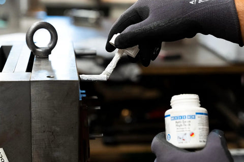 Applying Anti Seize High Tech Assembly Paste 450 G Metal Free High Temperature Resistant to machinery component.