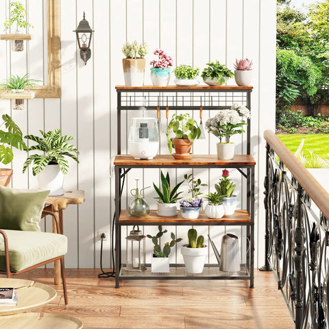 Rustic Brown Kitchen Bakers Rack With Power Outlets And A 31.5 Inch Desktop Four Tier Storage Coffee Bar Station With Eight S Hooks Microwave And Spice Organizer For Pots And Appliances featuring potted plants