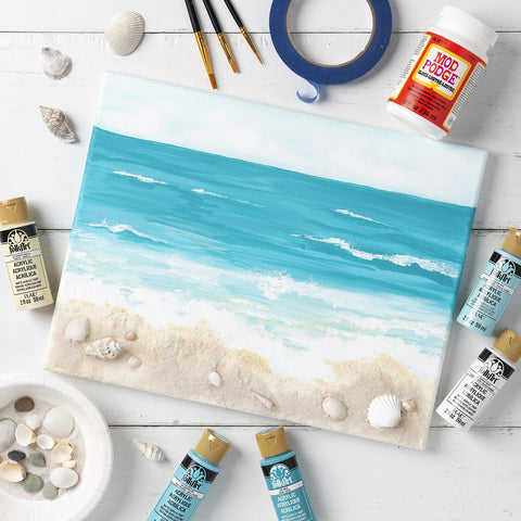 Beach painting canvas surrounded by All In One Glue Sealer Finish Clear Gloss For Wood Paper Fabric And More, 32 oz bottle