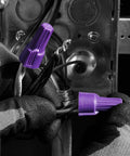 Close-up of hands using Purple Al/Cu Twist On Wire Connector Nuts For Aluminum To Copper And Copper To Copper, 18 AWG To 10 AWG.