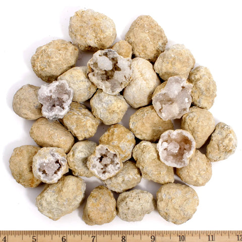 Top view of 25 medium Moroccan geodes with crystals, 1-1.5 inches, part of 'Break Your Own Moroccan Geodes With Crystals Inside A Hands On Fun Science Kit For Kids Includes 25 Medium 1 To 1.5 Inch Geodes 90 Percent Hollow Easy To Crack Open Educational Info And Instructions Plus Party Favors And Prizes.'