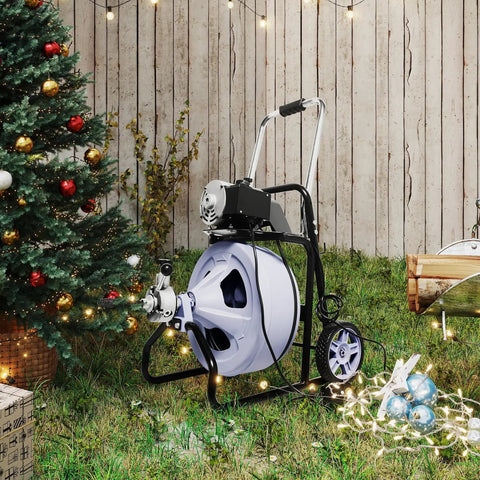 Kick Stubborn Clogs To The Curb With This Heavy Duty Electric Drain Cleaner in outdoor setting with Christmas tree.