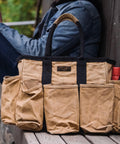 Waxed Canvas Tool Tote Bag for Tools Gardening Cleaning Supplies and Mobile Bar Durable 14 Inch Grab And Go Utility Organizer with Heavy Duty Handles Versatile Storage Tote with Pockets in tan and black