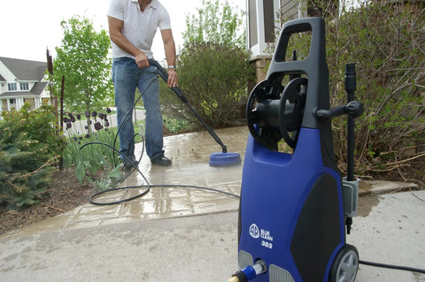 Man using Beast Mode Portable Pressure Washer 1900 PSI 1.51 GPM 14 Amp With Bayonet Attachments on a driveway