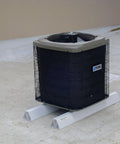 36-inch PVC rooftop support blocks under a York outdoor HVAC condenser on a flat roof