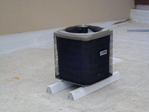 36-inch PVC rooftop support blocks under a York outdoor HVAC condenser on a flat roof
