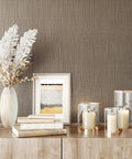 Taupe Metallic Grasscloth Peel And Stick Wallpaper Roll Featuring Faux Woven Texture With Subtle Shimmer on a stylish accent wall.