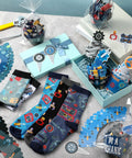 Twelve Pairs Men's Mechanic Socks Gift Set With Dope Cupcake And Gear Patterns, assorted colorful wrench-themed socks displayed in packaging.