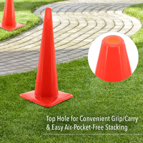 High Visibility Orange Safety Cone For Traffic And Worksites, 28 inch durable LDPE cone with top hole detail on grass