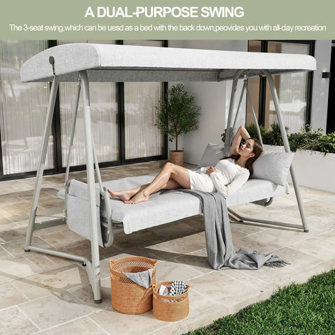 Oversized Outdoor Porch Swing With Adjustable Backrest And Canopy 2 In 1 Swing Bed, woman relaxing on patio with cushions.